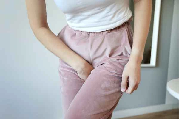 older woman running to the toilet because of urinary incontinence St Albans